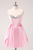Vestido de fiesta corto con escote en A sin tirantes y corsé en color rosa con lazos