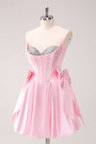 Vestido de fiesta corto con escote en A sin tirantes y corsé en color rosa con lazos