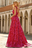 Vestido largo de graduación floral Línea A en fucsia con tirantes finos de brocado jacquard
