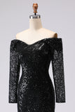 Vestido formal negro de malla y encaje con funda negra y manga larga