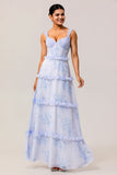 Vestido largo de invitada de boda con corsé floral azul con volantes en línea A
