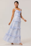 Vestido largo de invitada de boda con corsé floral azul con volantes en línea A