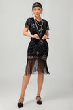 Vestido de lentejuelas doradas negras de los años 20 con flecos
