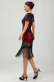 Vestido de lentejuelas doradas negras de los años 20 con flecos