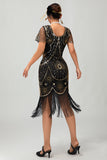 Vestido ajustado con flecos dorados y cuentas de la década de 1920