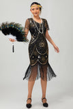 Vestido ajustado con flecos dorados y cuentas de la década de 1920