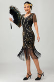 Vestido ajustado con flecos dorados y cuentas de la década de 1920