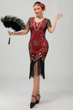 Vestido ajustado con flecos dorados y cuentas de la década de 1920