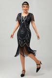 Vestido ajustado con flecos dorados y cuentas de la década de 1920
