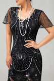 Vestido ajustado con flecos dorados y cuentas de la década de 1920