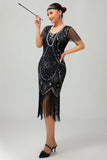 Vestido ajustado con flecos dorados y cuentas de la década de 1920