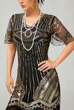 Vestido flapper ajustado de lentejuelas doradas negras de los años 20 con borlas
