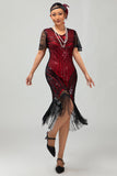 Vestido ajustado de la década de 1920 con cuello en V de lentejuelas plateadas negras y borlas