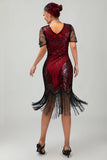 Vestido ajustado de la década de 1920 con cuello en V de lentejuelas plateadas negras y borlas