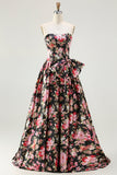 Vestido largo de graduación floral sin tirantes negro rosa con lazos