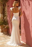 Vestido de novia con volantes de sirena marfil con abertura