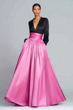 Vestido formal negro y fucsia con cuello en V y manga larga