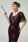 Vestido negro dorado con cuello en V de la década de 1920 con lentejuelas y flecos