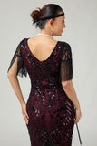 Vestido negro dorado con cuello en V de la década de 1920 con lentejuelas y flecos