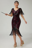 Vestido negro dorado con cuello en V de la década de 1920 con lentejuelas y flecos