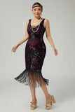 Vestido negro dorado de lentejuelas de la década de 1920 con flecos