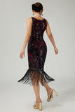 Vestido negro dorado de lentejuelas de la década de 1920 con flecos