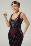 Vestido negro dorado de lentejuelas de la década de 1920 con flecos