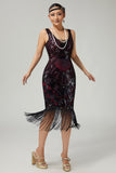 Vestido negro dorado de lentejuelas de la década de 1920 con flecos