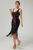 Vestido negro dorado de lentejuelas de la década de 1920 con flecos