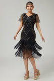 Vestido negro dorado con flecos de la década de 1920 con cuentas