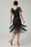 Vestido negro dorado con flecos de la década de 1920 con cuentas