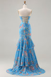 Vestido largo de graduación con volantes y sirena floral azul