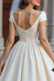 Vestido corto de novia marfil con lazo de Shouder