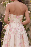 Vestido midi sin tirantes con moño rosa de flores blancas y estampado en línea A