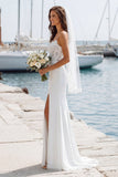 Vestido largo de novia con tirantes finos de marfil y abertura