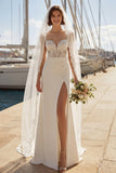 Vestido de novia con tirantes finos aplicados en marfil sirena y abertura