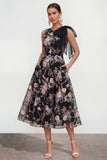 Un vestido midi multifloral con lazo estampado en línea y bolsillos