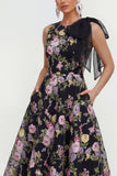 Un vestido midi multifloral con lazo estampado en línea y bolsillos