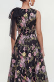 Un vestido midi multifloral con lazo estampado en línea y bolsillos