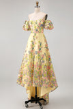 Vestido de invitad con alto y bajo con bordado floral amarillo y mangas abullonadas