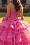 Vestido de gala Quinceañera con volantes fucsia con lazos