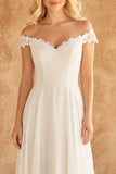 Vestido de novia de encaje marfil con encaje marfil descubierto