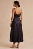 Vestido largo de corbata negra con tirantes finos y bolsillos