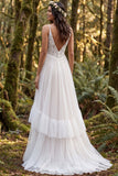 Vestido largo de novia de tirantes finos con volantes en línea A de marfil