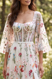 Vestido de novia largo corsé floral translúcido marfil línea A con abertura