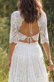 Vestido de novia largo de encaje marfil con escote en V y manga media con abertura