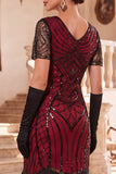 Vestido negro de los años 20 con flecos de manga corta y escote en V y lentejuelas