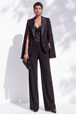 Traje de mujer de dos piezas negro con solapa de pico y bolsillos