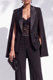 Traje de mujer de dos piezas negro con solapa de pico y bolsillos