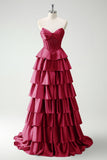 Vestido largo de baile con corsé de cuentas y cuentas de princesa en color burdeos con abertura